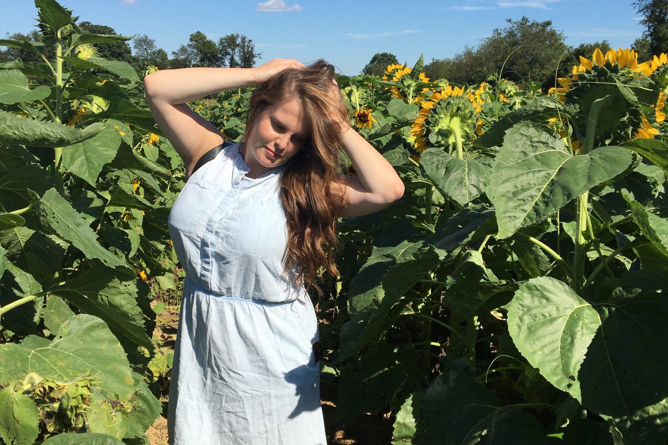 a girl in the sunflower field